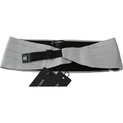 Dolce Gabbana silk cummerbund in gray with adjustable clip, 100% silk material, featuring logo details and stretch band, made in Italy.