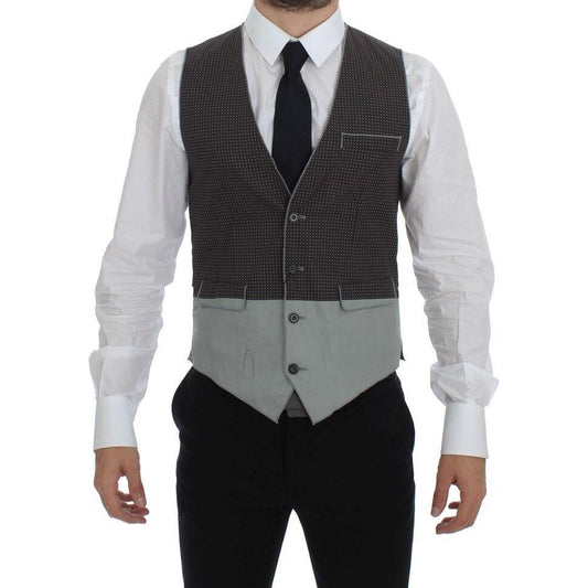 Dolce & Gabbana gray polka dot vest modeled on a man, featuring adjustable back strap and button closure.
