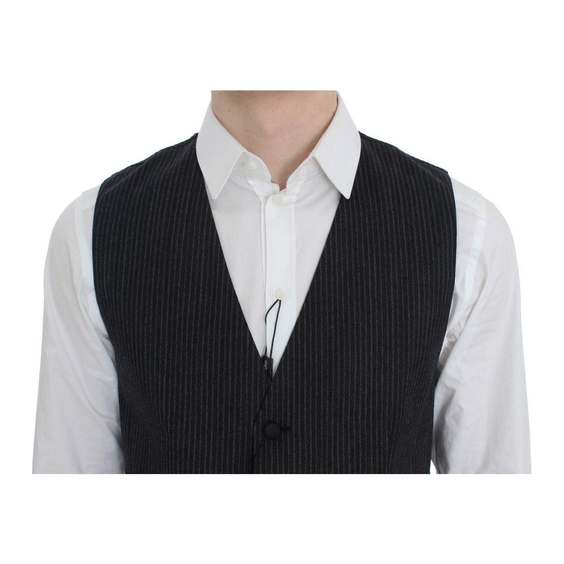 Dolce & Gabbana gray striped vest worn over a white shirt, featuring a full button closure and logo details.