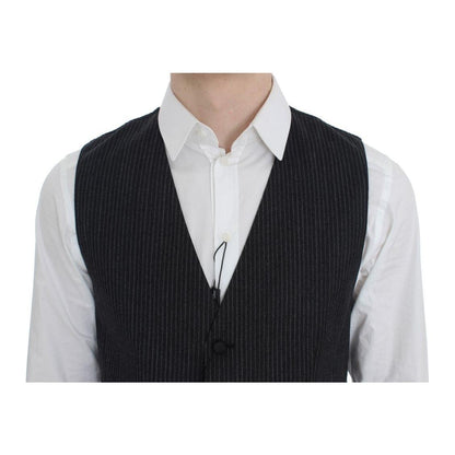 Dolce & Gabbana gray striped vest worn over a white shirt, featuring a full button closure and logo details.